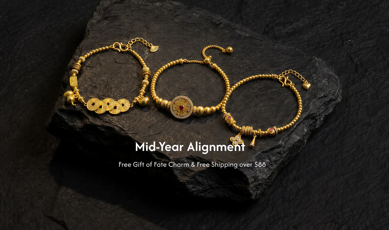 Gold spiritual bracelets on natural stone